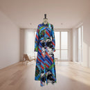 Colorful dress with abstract patterns on a mannequin against a plain background