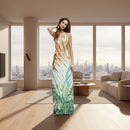 Woman wearing a strapless dress with a palm leaf pattern on a white background