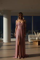 Pink sequin off-shoulder gown on a gray background