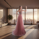 Pink evening gown with beaded back in a softly lit room