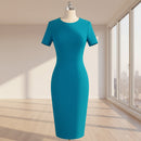 Teal dress on a mannequin against a white background