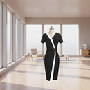 Black dress with white stripe on a mannequin against a white background