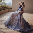 Woman in a long, dark blue evening gown on a white background