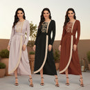 Three women wearing long dresses in beige, black, and red with lace details on a white background.