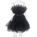 Black tulle dress on a mannequin against a white background