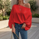 Women's off-shoulder satin blouse with an elegant asymmetric neckline