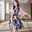 Woman wearing a floral dress with a white background