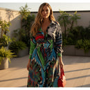 Woman in a colorful dress standing outside a store