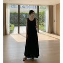 Women's sleeveless backless maxi tank dress with a flowing silhouette