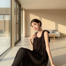 Women's sleeveless backless maxi tank dress with a flowing silhouette