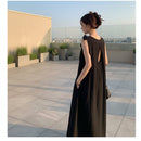 Women's sleeveless backless maxi tank dress with a flowing silhouette